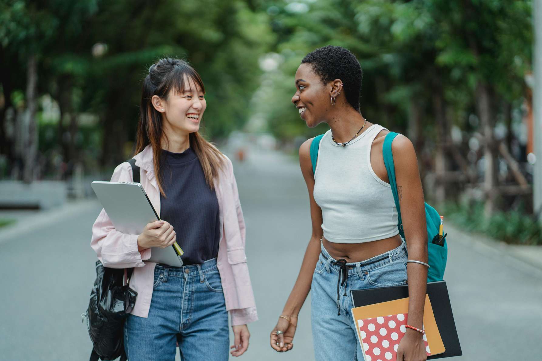 Two female students sharing a joke